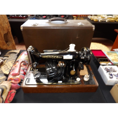 353 - A vintage Singer electric portable sewing machine