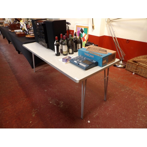 361 - A folding trestle table