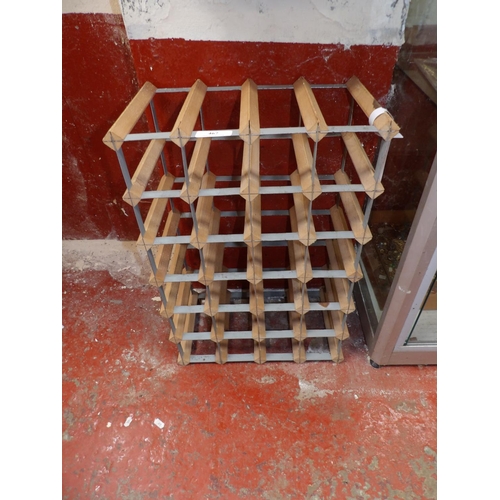 467 - A metallic and wooden wine rack