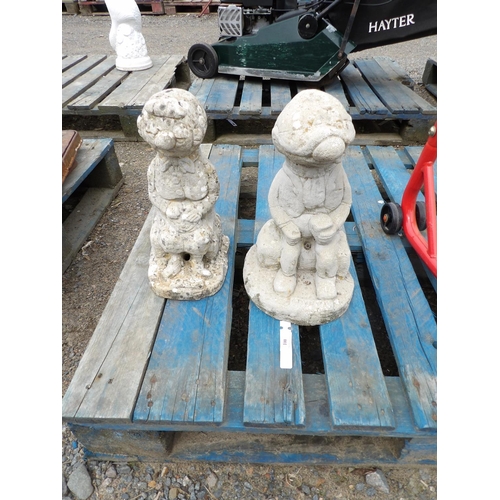 100 - A pair of reconstituted stone figural models Andy Capp and Flo