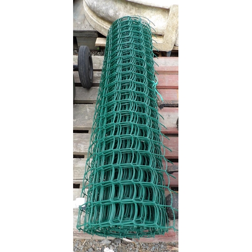 95 - A roll of green plastic garden netting