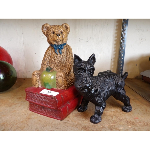 151 - Two cast iron door stops one modelled as a teddy bear upon two books the other a Scotty dog
