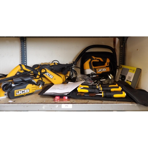 152 - Three JCB power tools together with a set of JCB wood chisels, a hole saw set, a crimping tool etc.