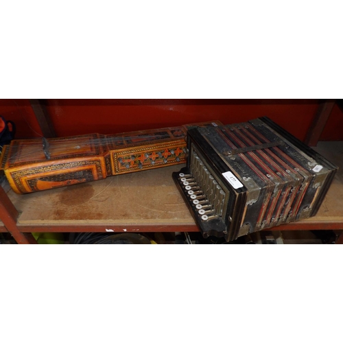 177 - A vintage concertina together with a vintage oriental stringed instrument
