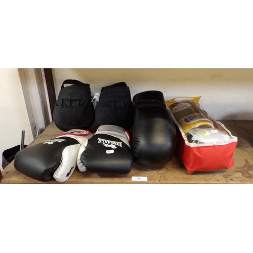 483 - Three pairs of boxing gloves together with a pair of training mitts