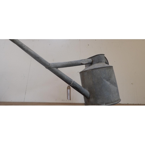 126 - A vintage galvanised German watering can with Swastika insignia to base