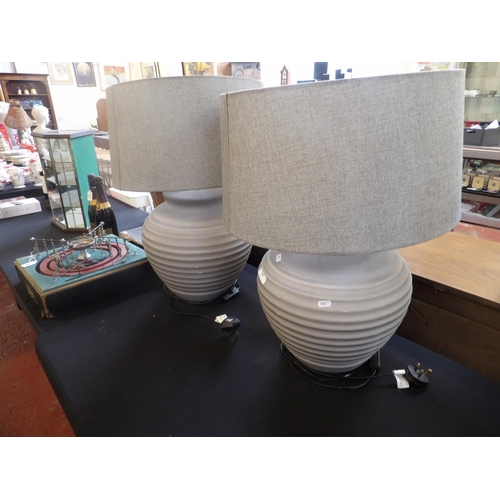 285 - A pair of large pottery table lamps finished in grey