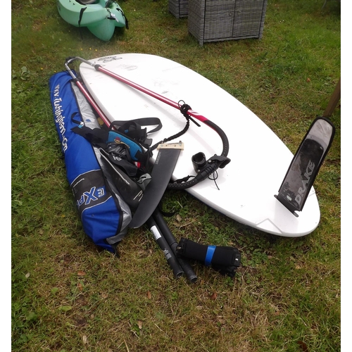 16 - A wind surfing board and accessories