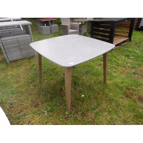 19 - A limed effect and grey finished patio table