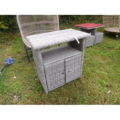 21 - A Blue Diamond all weather rattan patio cabinet fitted a shelf above two doors