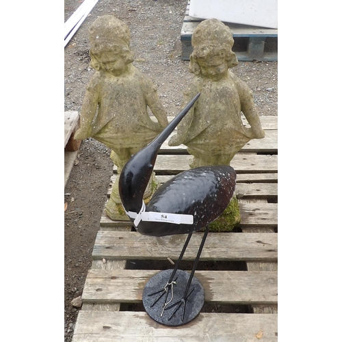 54 - A metallic model of a wading bird together with a pair of reconstituted stone models of girls