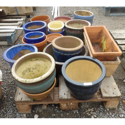 55 - An assortment of salt glazed stone ware and terracotta planters and troughs