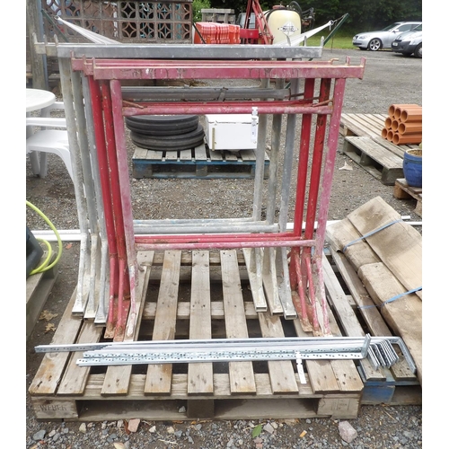 60 - Two sets of three building trestles together with a quantity of galvanised flat steel