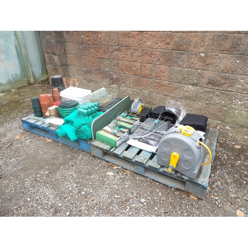 77 - An assortment of garden accessories, two hose reels etc.