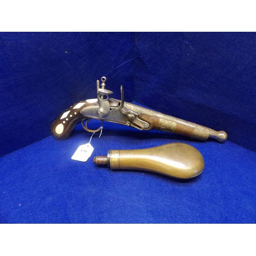 430 - An antique oriental flintlock pistol together with a brass shot flask