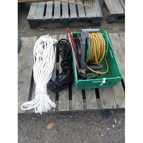 111 - Two lengths of rope, a hose and reel etc.