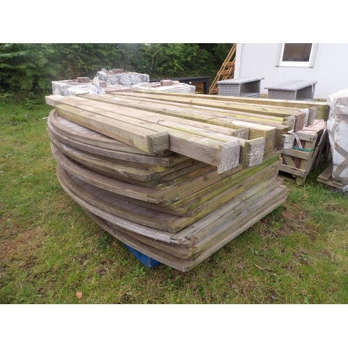 26 - Seventeen arched tongue and groove fencing panels (145cm high x 180cm wide) together with twelve pos... 