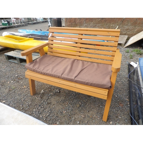 43 - A wooden garden bench complete with cushion