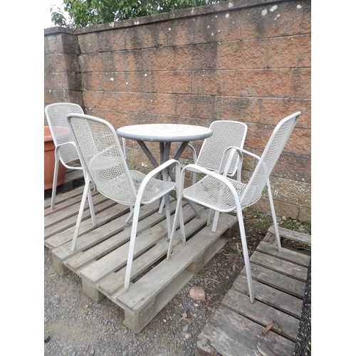 56 - A circular patio table with stone mosaic top together with four chairs