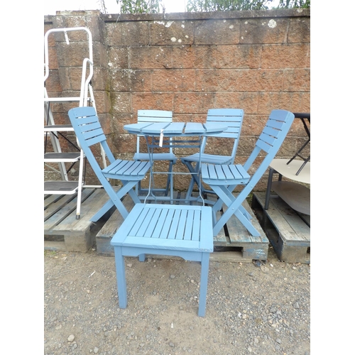 59 - A wooden and metallic circular folding garden table together with four matching chairs and a coffee ... 