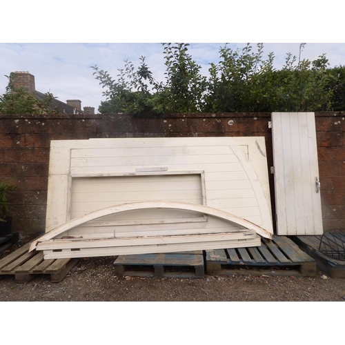 63 - A pair of substantial timber arched entrance gates, one fitted a personnel door, complete with frame... 