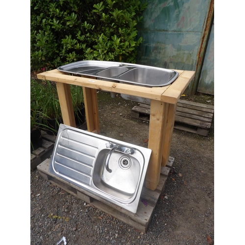 68 - A Franke stainless steel 1 1/2 bowl sink together with one other and a wooden stand