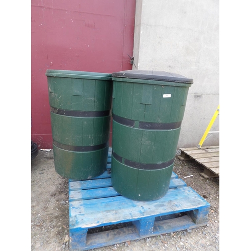 84 - Two cylindrical green PVC water butts modelled in the form of casks