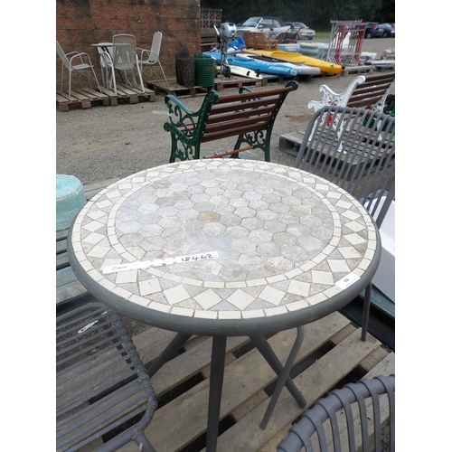 94 - A circular patio table with stone mosaic top together with four chairs