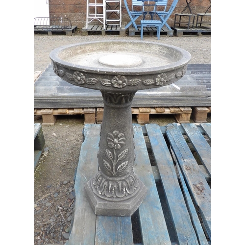 97 - A reconstituted stone circular bird bath with floral decoration