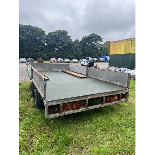 18 - A galvanised tandem axle drop side trailer fitted a new floor and complete with a pair of loading ra... 