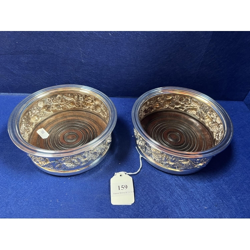 159 - A pair of substantial vintage silver and mahogany wine coasters