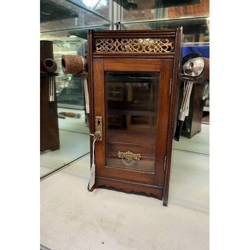 365 - An Edwardian glazed walnut smoker's compactium together with assorted smoker's pipes