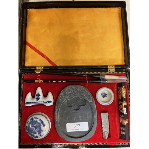 377 - An oriental painting set