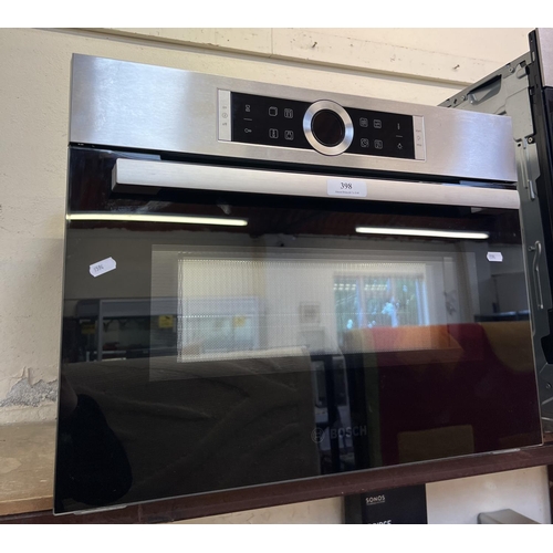 398 - A Bosch CMG633BSIB integrated combination microwave oven - new and unused