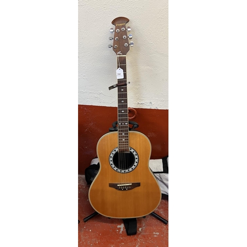 242 - A Westfield electric acoustic guitar and stand