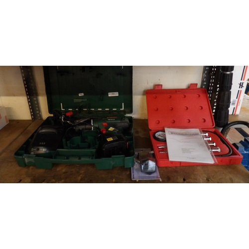 112 - A Bosch 18 volt cordless drill complete with charger together with a Sealey eight piece petrol engin... 