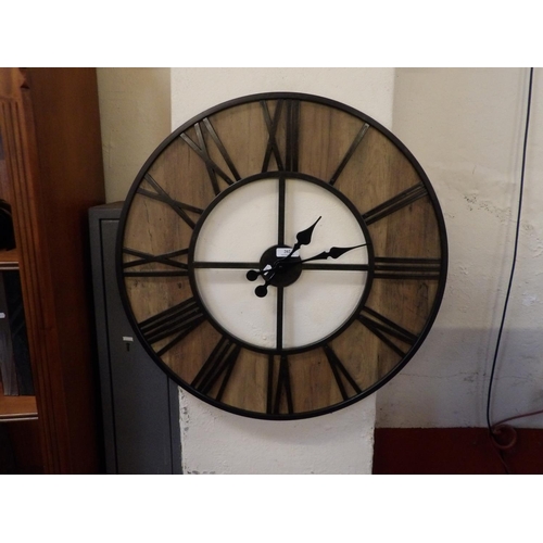 202 - A circular wall clock of skeletal design