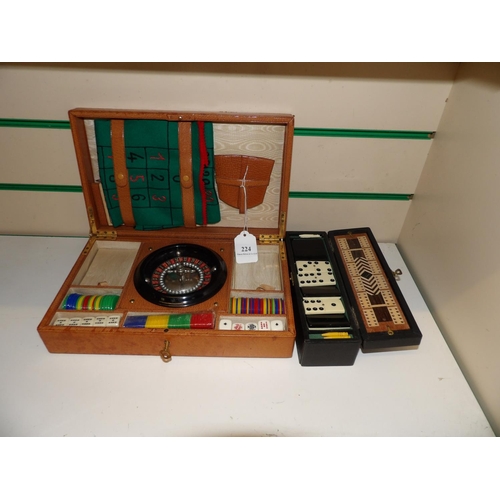 224 - A travelling compact gaming set together with a boxed domino and crib set