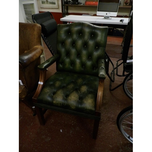 295 - A mahogany open armchair upholstered in Emerald Green coloured button back leather