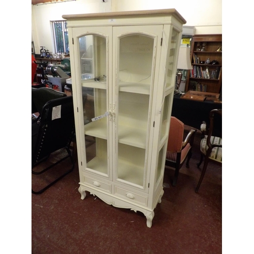 344 - A glazed and illuminated display cabinet fitted two short drawers below