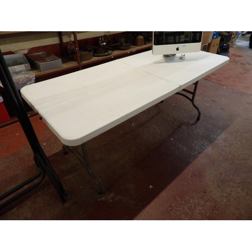 347 - A folding trestle table