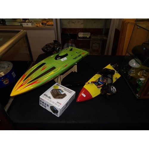 357 - A remote controlled model power boat together with one other (a/f)