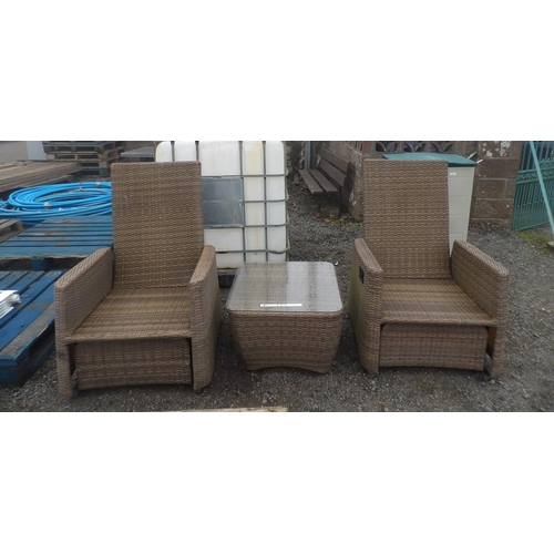 48 - A pair of all weather rattan rocking patio chairs together with a matching coffee table