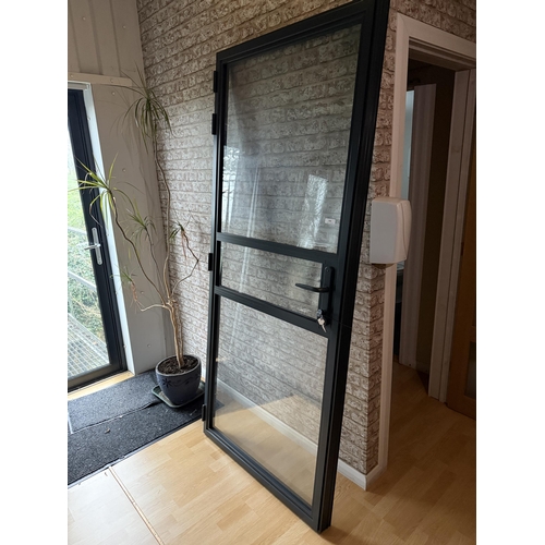 166 - A fully glazed aluminium door and frame