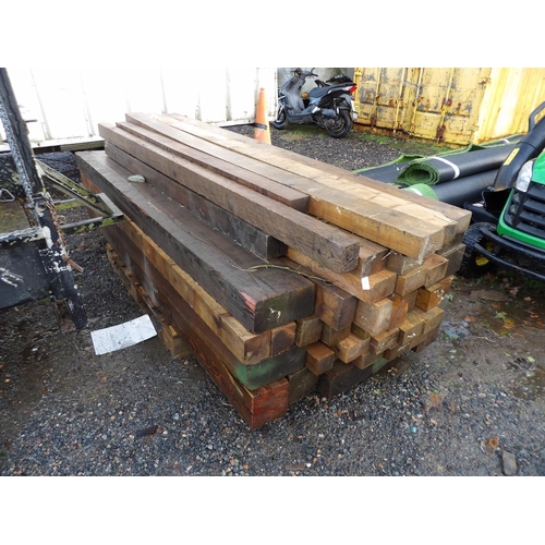 24 - A quantity of wooden fencing posts and reclaimed serviceable timber