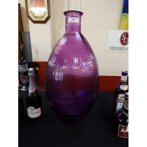 296 - An amethyst glass vase of large proportion