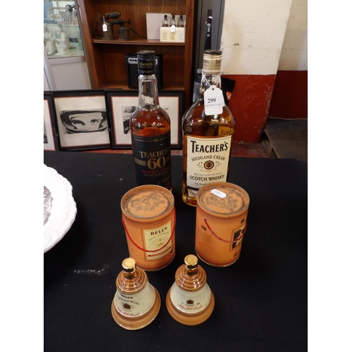 299 - Two bottles of Teacher's Scotch Whisky together with two Bell's commemorative Whisky decanters of di... 