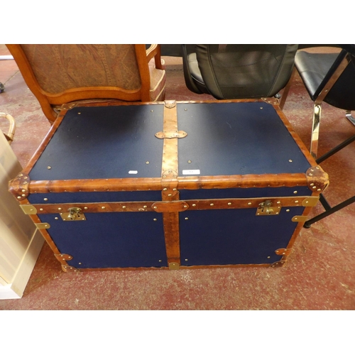 361 - A brass and leather bound steamer trunk finished in blue and modelled in the Victorian style