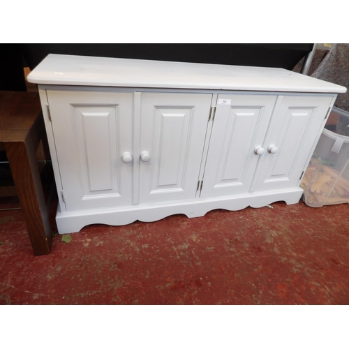 324 - A shabby chic pine four door cabinet