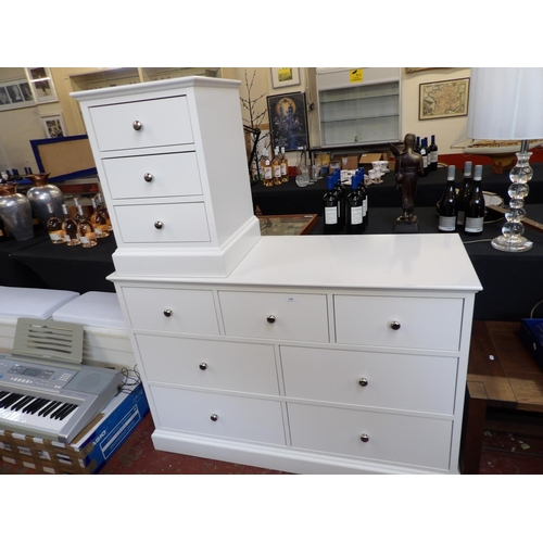 328 - A chest of seven drawers and matching three drawer bedside chest finished in white